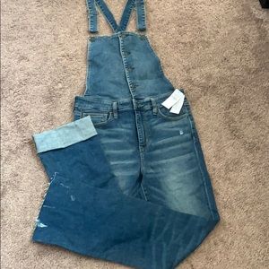 Medium washed skinny jean overalls fit like a size 8